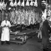 Butchers at Smithfield meat market in London, circa 1935. (Photo by Hulton Archive/Getty Images)
