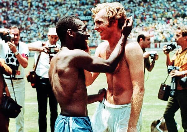 Great game: Pele and Bobby Moore at the end. Picture: John Varley