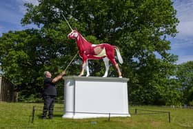 Operations worker Andrew McCallum cleans Damian Hirst's unicorn Myth as work continues behind the scenes during the lockdown period at the Yorkshire Sculpture Park. Picture: Tony Johnson