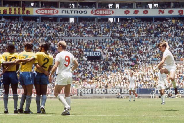 Letting fly: Martin Peters shoots past the Brazil wall. Picture: John Varley