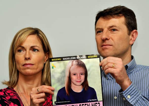 Gerry and Kate McCann with a photo of their missing daughter Madeleine.