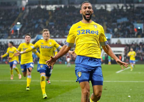 Hero: Leeds United's Kemar Roofe celebrates scoring the stoppage-time winner. Picture: PA