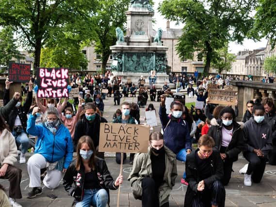 Protesters in the UK kneel in silence in memory of George Floyd who was killed in the US.(Photo: Kelvin Stuttard).