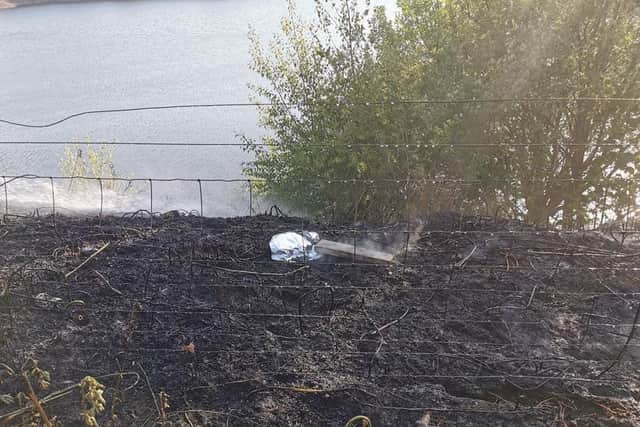 The remnants of a disposable barbecue were found following a fire at Digley reservoir in West Yorkshire last weekend. Picture: WYFRS