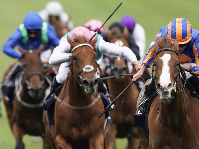 Love and Ryan Moore (right) were impressive winners of the Qipco 1000 Guineas.
