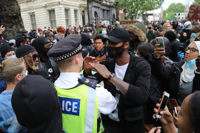Police and protesters during the Black Lives Matter protest rally in Whitehall, London.