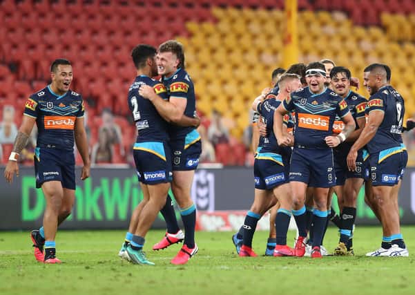 Ashley Taylor of Gold Coast Titans celebrates victory. (Photo by Chris Hyde/Getty Images)