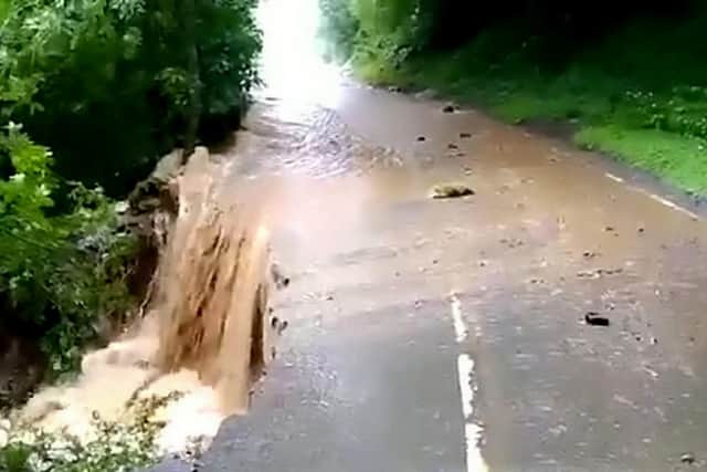 Flooding on the road between Grinton & Leyburn last summer. Pic by North Yorkshire Police/SWNS