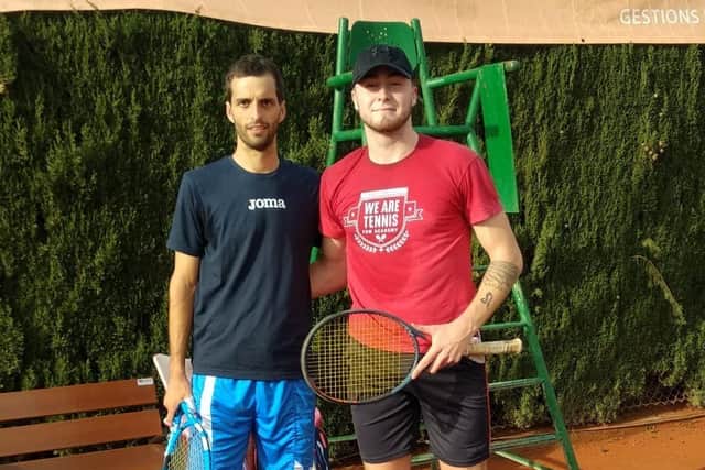 George with his coach in Spain