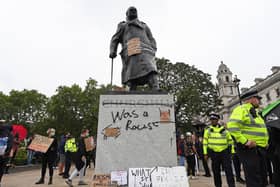 Graffiti on the Winston Churchill statue during the Black Lives Matter protest rally in Parliament Square, Westminster, London, in memory of George Floyd who was killed on May 25 while in police custody in the US city of Minneapolis.