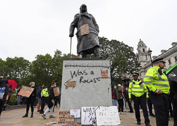 Graffiti on the Winston Churchill statue during the Black Lives Matter protest rally in Parliament Square, Westminster, London, in memory of George Floyd who was killed on May 25 while in police custody in the US city of Minneapolis.