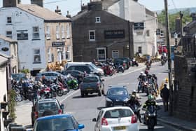Large groups of bikers gather in Hawes on a warm weekend in May