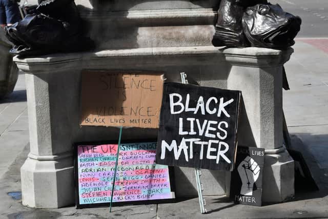 Signs by the empty plinth where the statue of Edward Colston in Bristol once stood after it was taken down during a Black Lives Matter protest on Sunday.