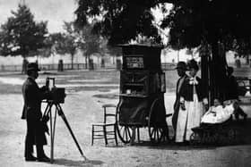 1877:  A street photographer at work on Clapham Common, London, with a mobile booth.  Original Publication: From 'Street Life in London' by John Thomson and Adolphe Smith - pub. 1877  (Photo by John Thomson/General Photographic Agency/Getty Images)