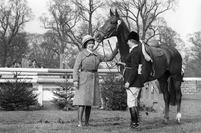 A 'well done' pat for Doublet as the Queen congratulates Princess Anne and her mount after they had taken fifth place in the Badminton Horse Trials.