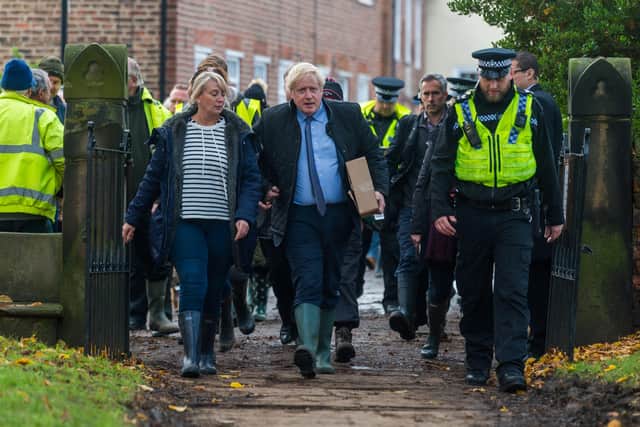 Boris Johnson arrives in Fishlake to meet flooding victims. Photo: James Hardisty.