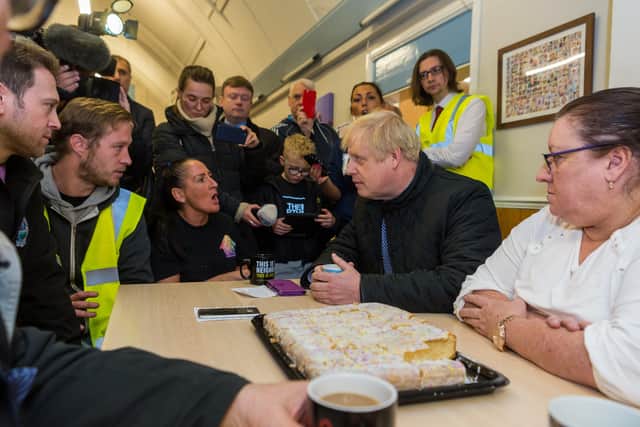 Boris Johnson meets flooding victims in Fishlake. Photo: James Hardisty.