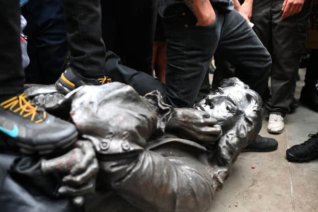Protesters pull down a statue of Edward Colston during a Black Lives Matter protest rally in College Green, Bristol, in memory of George Floyd.