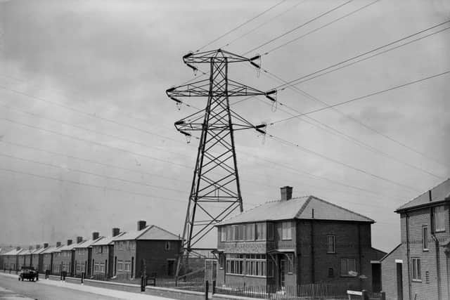 A housing estate in Warrington built around an electricity pylon.   (Photo by Fox Photos/Getty Images)