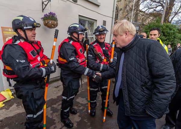 Boris Johnson meets rescuers after last year's Don Valley floods.