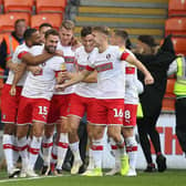 FULLY DESERVED: Rotherham United's players have secured promotion back to the EFL Championship at the first attempt. Picture: Nigel French/PA