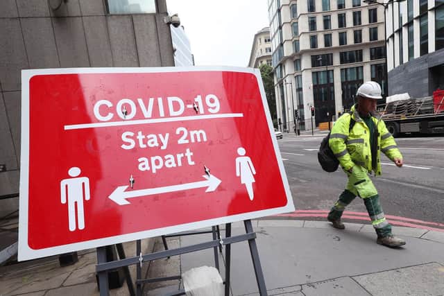 Signage related to social distancing and Covid-19, following the introduction of measures to bring England out of lockdown. Photo: PA