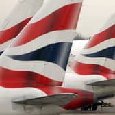 File photo of tail fins of British Airways' aircraft parked at Terminal One of London's Heathrow Airport. British Airways' treatment of its workforce during the coronavirus pandemic "is a national disgrace", MPs claimed. Photo: PA
