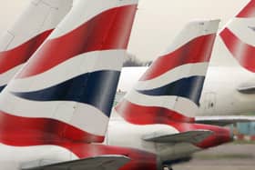File photo of tail fins of British Airways' aircraft parked at Terminal One of London's Heathrow Airport. British Airways' treatment of its workforce during the coronavirus pandemic "is a national disgrace", MPs claimed. Photo: PA