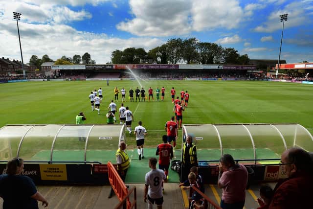 Teams run out on to the Bootham Crescent pitch for the game between York City  and FC United of Manchester in August 2017. Picture: Bruce Rollinson.