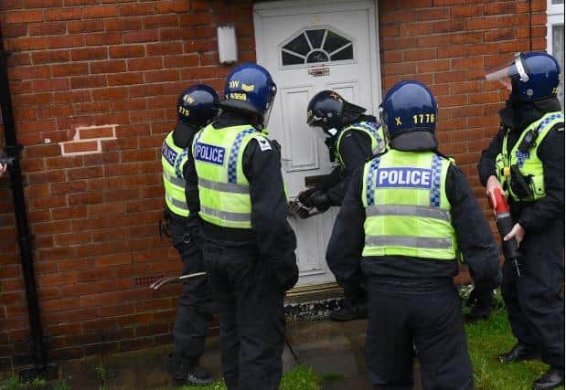 A man and two women were arrested after an armed police raid in West Yorkshire.