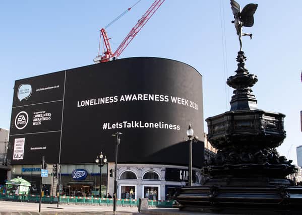 A digital billboard goes on display in Piccadilly Circus during Loneliness Awareness Week as gaming company Electronic Arts joins with UK Government and mental health charity CALM to launch the #LetsTalkLoneliness campaign, London. Photo: Jeff Spicer/PA