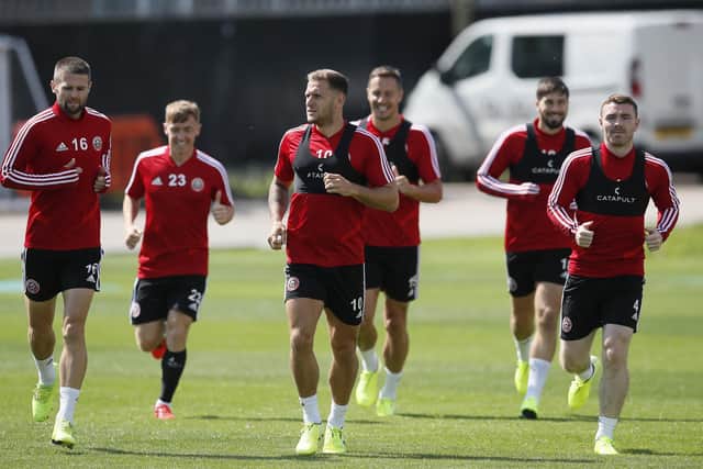Captain Billy Sharp of Sheffield Utd leads the players in a warm up during training before their first game in the Premier League at the Steelphalt Academy, Sheffield. Picture date: 8th August 2019. Picture credit should read: Simon Bellis/Sportimage