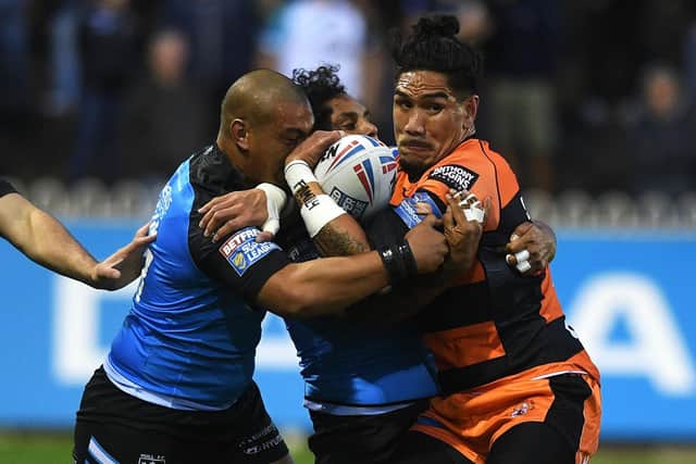 IN THE THICK OF IT: Castleford Tigers' Tigers Jesse Sene-Lefao is tackled by Hull FC's Sika Manu and Albert Kelly during a Super League clash last season.
Picture: Jonathan Gawthorpe
.