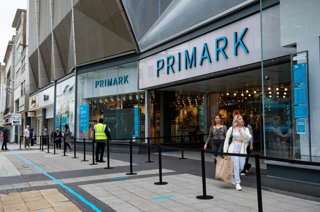 Shoppers leave Primark in Birmingham, as further coronavirus lockdown restrictions are lifted in England.