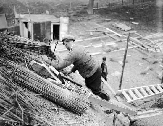 April 1929:  A man thatching a roof at Oxshot, Surrey.  (Photo by Fox Photos/Getty Images)