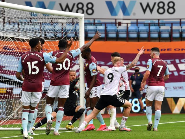 Aston Villa goalkeeper Orjan Nyland appears to carry the ball over the line as Sheffield United players appeal during the Premier League match at Villa Park, Birmingham. (Picture: Paul Ellis/PA)