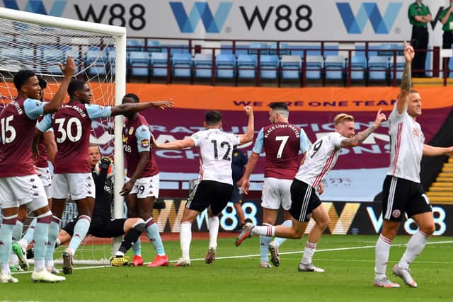 Aston Villa goalkeeper Orjan Nyland gets away with it (Picture: PA)