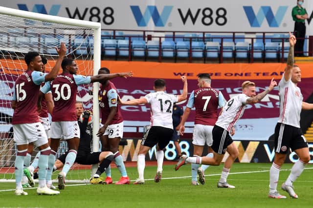 Aston Villa goalkeeper appears to carry the ball over the line (Picture: PA)