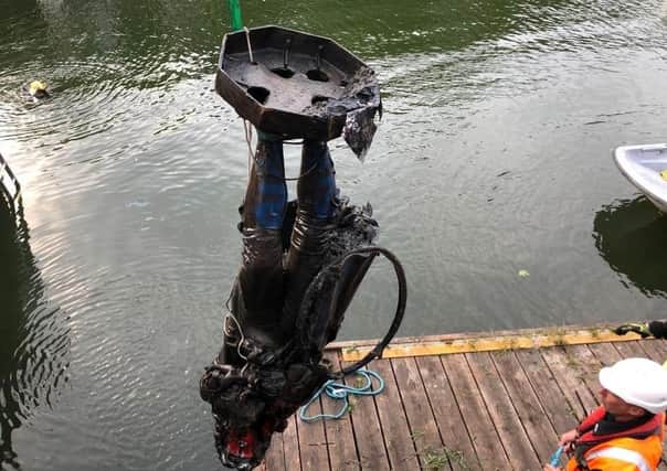 The statue of slave trader Edward Colston is removed from the River Avon following recent protests by the Black Lives Matter movement.