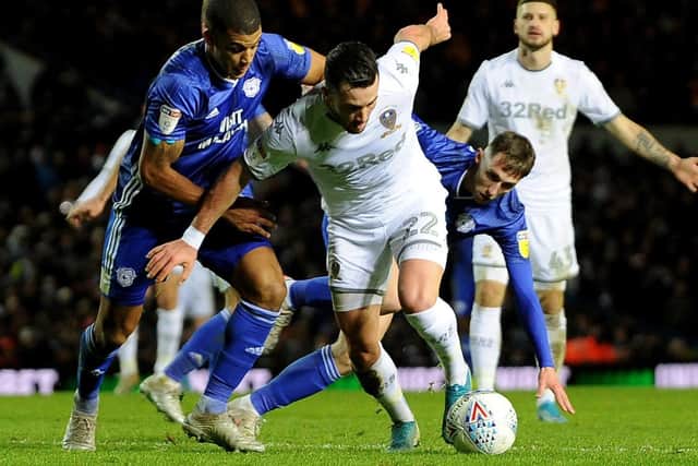 Return meeting: Jack Harrison is challenged by Cardiff's Lee Peltier at Elland Road. Picture: Simon Hulme