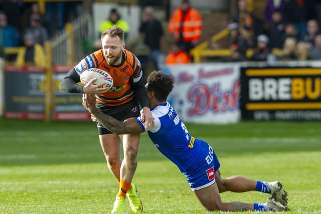 Jordan Rankin is tackled by St Helens' Kevin Naiqama in his final game for Tigers three months ago. Picture by Tony Johnson.