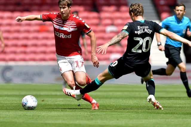 Middlesbrough's Paddy McNair takes the ball past Ben Wilmot.