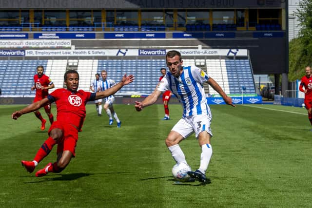 Huddersfield Town's Harry Toffolo has his cross blocked by Wigan's Nathan Byrne. (Picture: Tony Johnson)