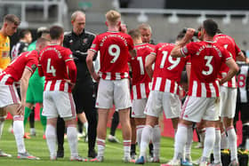 Sheffield United manager Chris Wilder talks to his players as they take a drinks break at St. James's Park. Picture: Simon Bellis/Sportimage