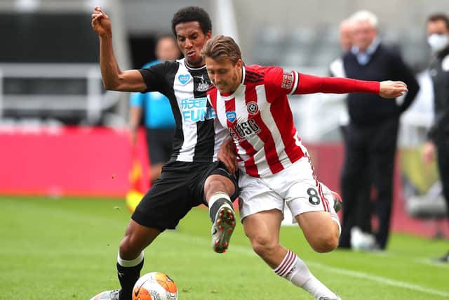 Sheffield United's Luke Freeman is tackled by Newcastle United's Isaac Hayden at St. James's Park. Picture: Simon Bellis/Sportimage