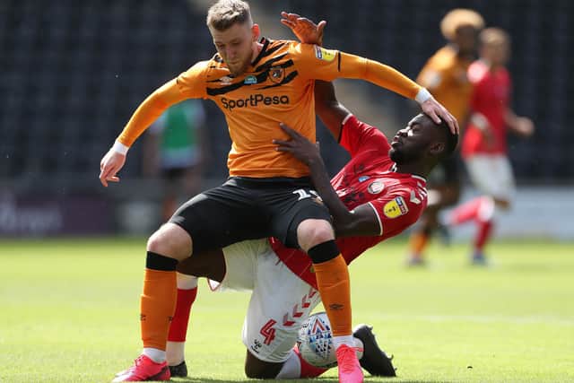 My ball: Charlton Athletic's Adedeji Oshilaja tackles Hull City's Josh Bowler. Picture: PA