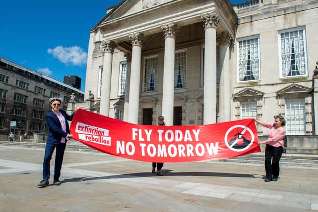 Extinction Rebellion protesters lobby Leeds City Council over Leeds Bradford Airport's controversial planning application.