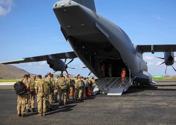 Ministry of Defence handout photo dated 5/10/2017 of Royal Marines boarding a Royal Air Force A400M aircraft at Terrance B. Lettsome Airport on the British Virgin Island bound for Barbados. A month after the most powerful hurricane in decades pummelled the Caribbean, life in affected British overseas territories is "moving back towards normality", the head of the UK Task Force has said.