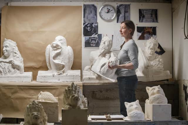 Carver Kibby Schaefer works with plaster models of characters from the children's book series The Chronicles of Narnia by CS Lewis, at Wolds Workshop in Full Sutton
