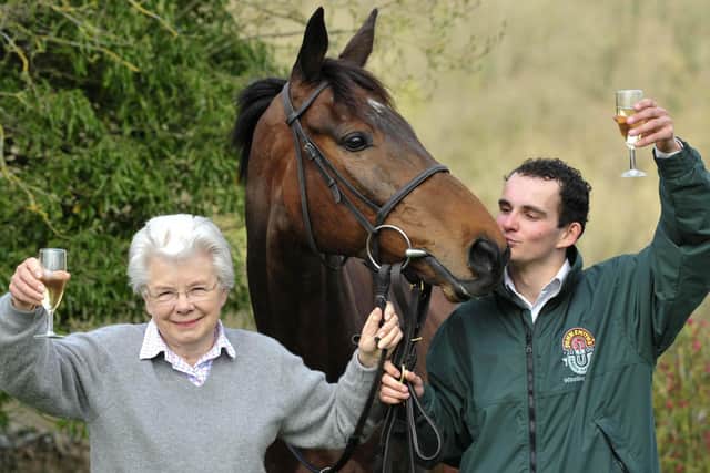 Liam Treadwell celebrates Mon Mome's Grand National win with owner Vida Bingham. This picture was published on the front page of The Yorkshire Post after the win in 2009.